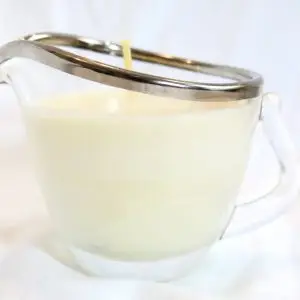 Ola Balms Lotion Candle showing silver lined glass